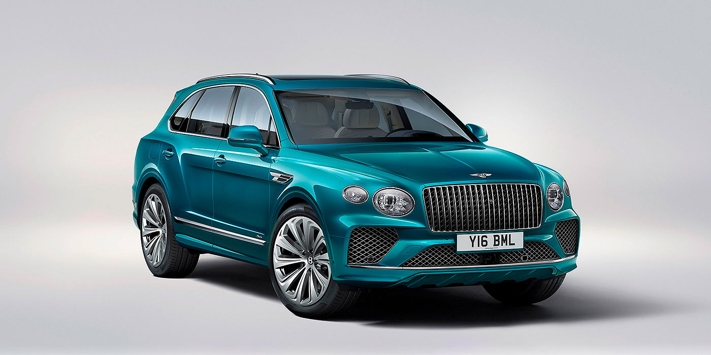 Bentley Beirut Bentley Bentayga Azure front three-quarter view, featuring a fluted chrome grille with a matrix lower grille and chrome accents in Topaz blue paint.