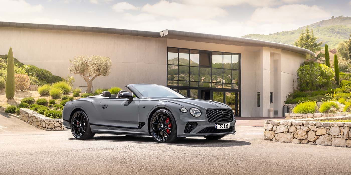 Bentley Beirut Bentley Continental GTC S convertible in Cambrian Grey paint front 34 static near house