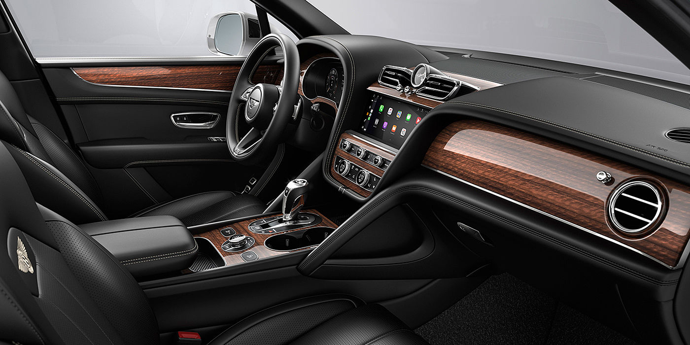 Bentley Beirut Bentley Bentayga interior with a Crown Cut Walnut veneer, view from the passenger seat over looking the driver's seat.