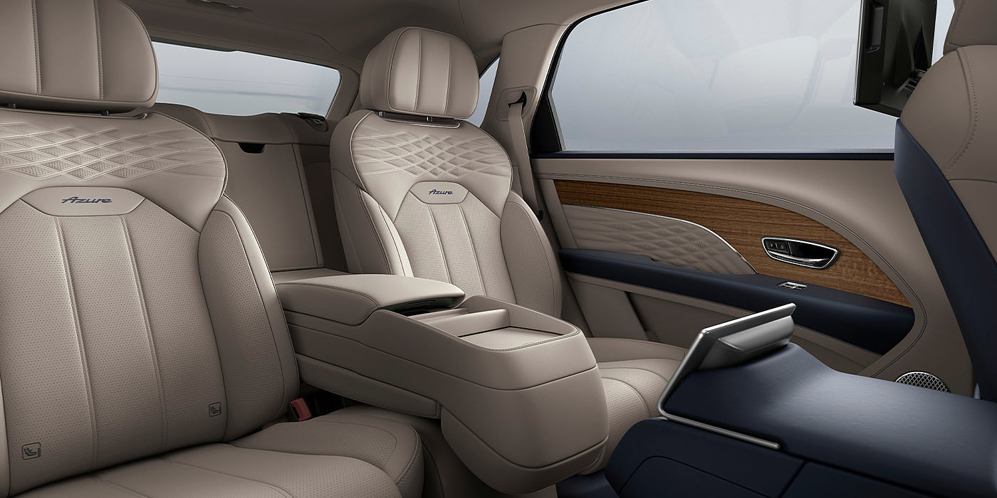 Bentley Beirut Bentley Bentayga EWB Azure interior view for rear passengers with Portland hide featuring Azure Emblem in Imperial Blue contrast stitch.