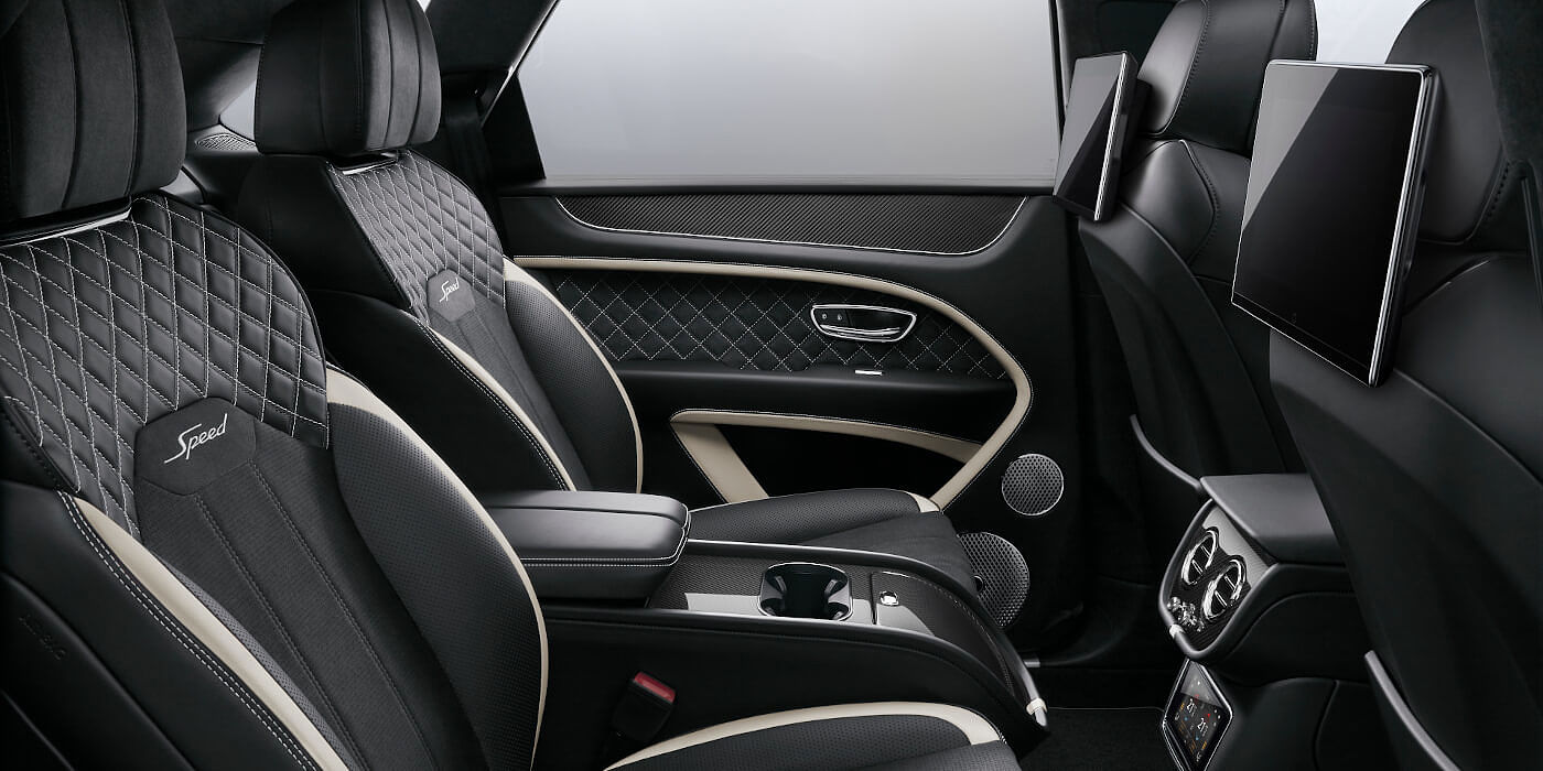 Bentley Beirut Bentley Bentayga Speed SUV rear interior in Beluga black and Linen hide with carbon fibre veneer