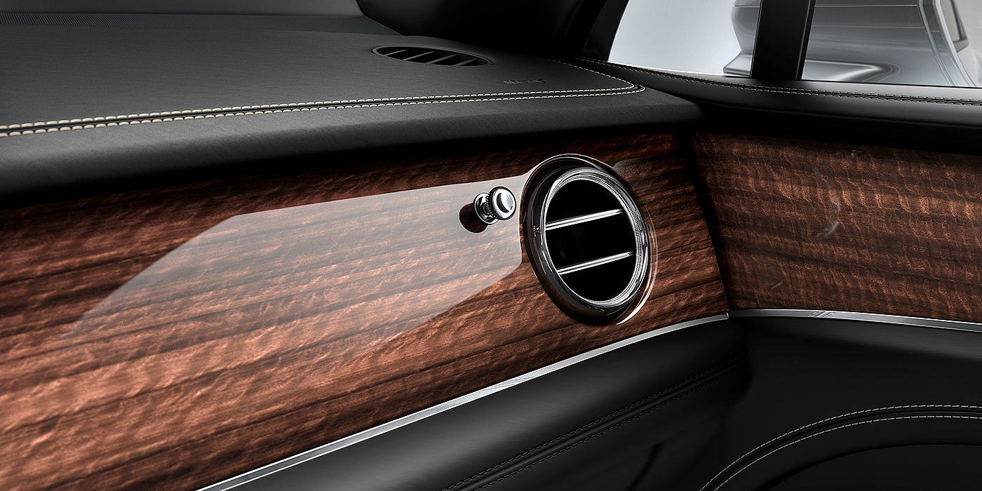 Bentley Beirut Bentley Bentayga front interior Crown Cut Walnut veneer and chrome air vent.