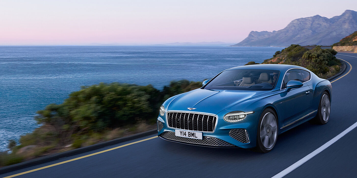 Bentley Beirut New Bentley Continental GT Azure coupe in Light Windsor blue paint with 22 inch Azure wheels and chrome grill, driving dynamically by the se