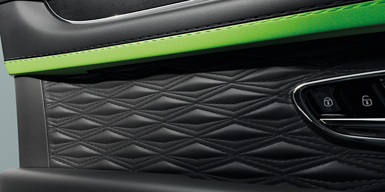 Bentley Beirut Bentley Bentayga Speed SUV interior door detail with Diamond in Diamond stitched hide in Beluga black colour, with Black stained Crown Cut Walnut veneer