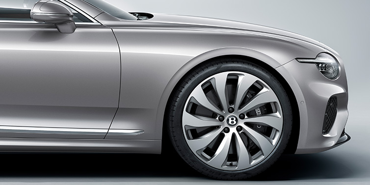 Bentley Beirut New Bentley Continental GT coupe side view featuring bonnet in Silverlake paint and 22 inch ten spoke silver painted and bright machined wheel