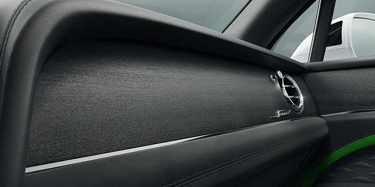 Bentley Beirut Bentley Bentayga Speed SUV front dash close up in Hyper Green and Beluga black hides, with Black Stained Crown Cut Walnut veneer