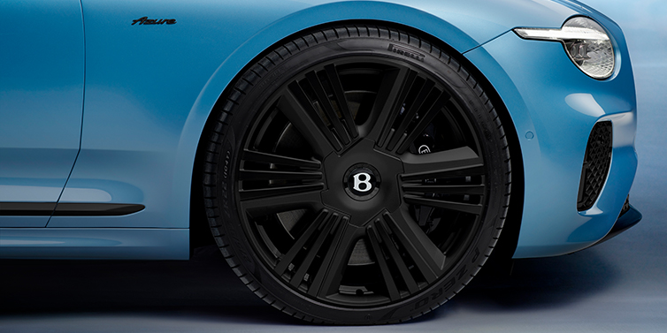 Bentley Beirut New Bentley Continental GTC Azure convertible front wheel detail with 22 inch black ten spoke wheel and dark chrome details against Light Windsor blue paint