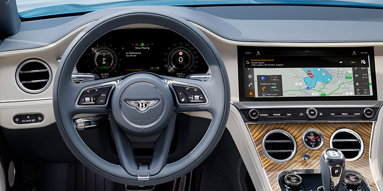 Bentley Beirut New Bentley Continental GT Azure coupe front interior in Linen and Brunel blue hides, showing steering wheel and driver's instruments