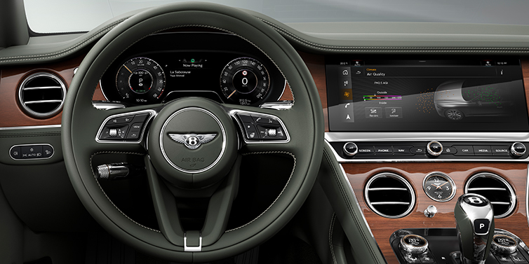 Bentley Beirut New Bentley Continental GT coupe steering wheel and front cabin view in Cumbrian Green hide and Crown Cut walnut veneer